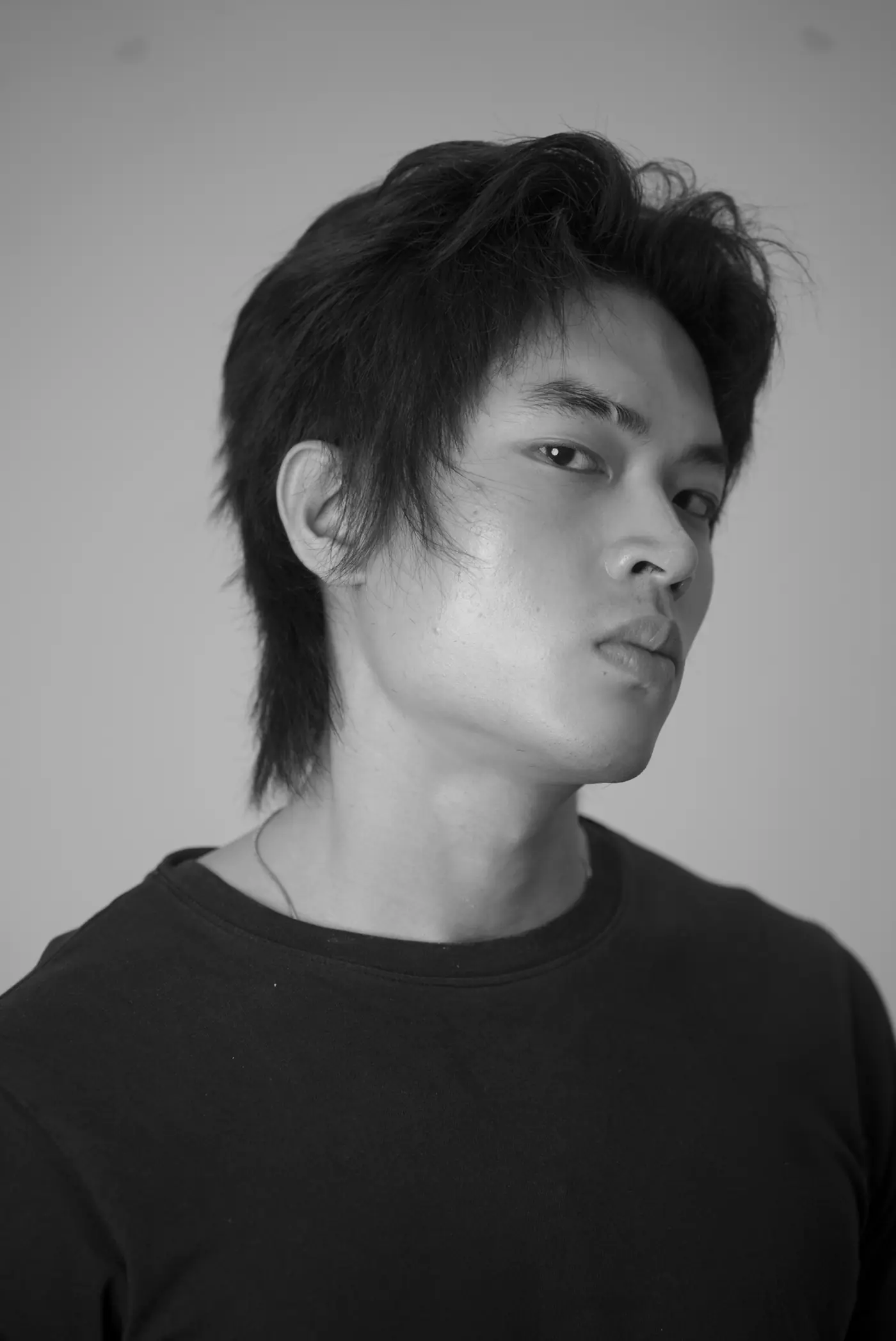 Headboss model with a textured mullet, black and white